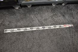 A surveyors measuring rule or stick
