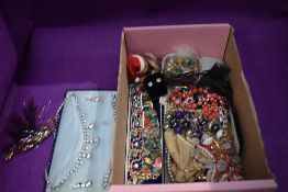 A box of mixed vintage costume jewellery including bracelets