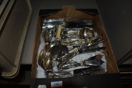 A box full of varied vintage cutlery.