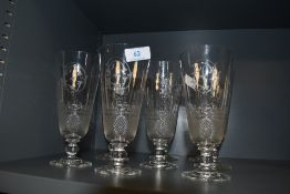 A set of eight fine clear cut crystal ale glasses having etched decoration with motif