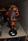 A table lamp having colour glass body and shade in the form of a mushroom