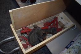 A set of vintage bearing pullers or similar and a marmalade cutter.