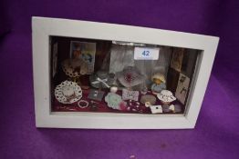 A model diorama of a hat shop window