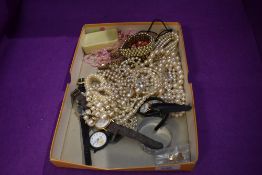 A selection of costume jewellery including watches, simulated pearl necklaces, etc