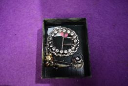 A small selection of white metal jewellery, some stamped silver including a Scottish Dirk brooch,