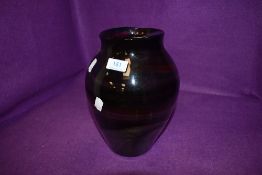 A colourful vintage statement glass vase, having petrol colours running throughout.