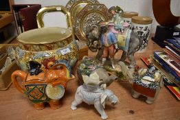 A selection of elephant style tea pots and a planter most AF