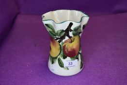 A vintage Wemyss vase having apple and foliage design.