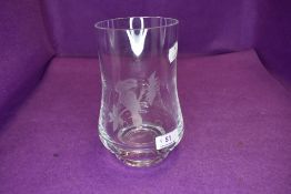 A modern clear cut crystal etched glass vase depicting a tucan bird signed LS 74 to base and