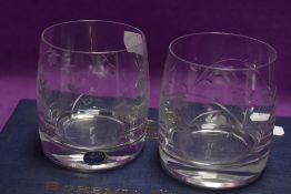 Two Bohemia crystal tumblers having etched fuchsia decoration.