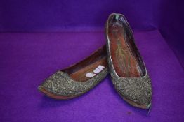 A pair of antique middle eastern Islamic style slippers having fine hand stitched details