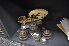 A good selection of cast kitchen weights and a balance scale