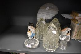 Three glass light shades a pair of porcelian dog figures and a stone cut decoration