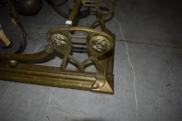 An Art Nouveau brass fire fender, width approx. 134cm