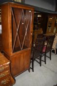 An early 20th Century display cabinet of slim proportions, some damage to beading, no keys and