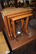 A modern nest of of three stylised tables