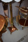 An early 20th Century brass and copper standard lamp
