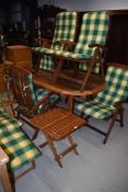 A selection of teak garden furniture including lounger