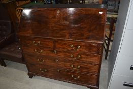 A fine Georgian mahogany bureau having fitted interior with inlaid detailing and two over three