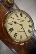 A late 19th or early 20th Century mahogany cased wall clock, station or office type, named to face