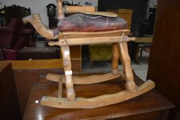 A traditional camel stool, fitted with rockers