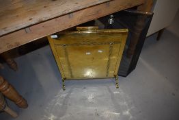 An Art Nouveau style brass fire screen and a modern spark guard