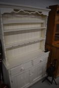 A painted kitchen dresser of slim proportions