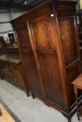 An early 20th Century oak panelled wardrobe, width approx. 115cm