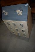 A modern dolls house, unfurnished, width approx. 59cm