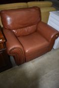 A modern leather manual recliner armchair
