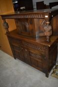 A reproduction oak court cupboard, width approx. 130cm