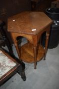 A late 19th or early 20th Century golden oak occasional table having hexagonal top and circular