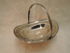 A Georgian silver table basket having leaf and scallop shell etched decoration and swing handle,