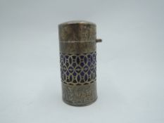 An Edwardian silver scent bottle having blue glass liner, clear glass stopper and pierced and