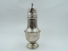 A silver sugar caster of waisted baluster form having pierced push on lid, Birmingham 1958, Adie