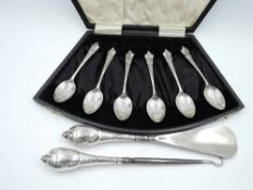 A cased set of six silver coffee spoons having moulded terminals, Birmingham 1923, W H Haseler