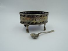A Victorian silver salt of oval form having pierced and engraved swag decoration, plain cartouche,