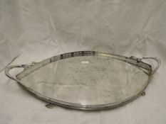 An Edwardian Art Nouveau silver lozenge shaped serving tray having pierced gallery detail,