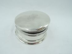 A small circular dressing table pot having hinged lid bearing monogram and blue velvet lining,