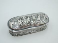 A small Dutch silver trinket box having hinged lid and extensive scenic repousse decoration,
