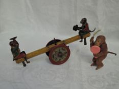 A 1920's Distler German DRGM tin plate lithograph clockwork Monkey See-Saw (af) along with a