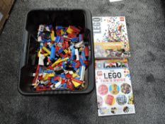 A box of vintage Lego pieces along with The Lego Book including Standing Small and The Lego Fans