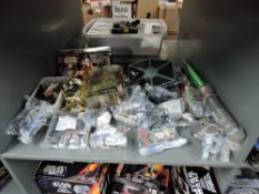 A shelf of modern Kenner and Hasbro Star Wars figures and accessories
