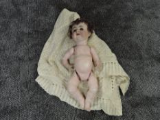 An early 20th century Alt Beck & Gottschalck bisque headed doll having sleep blue eyes, open mouth
