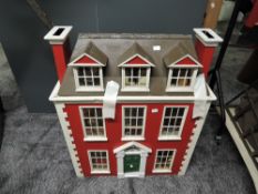 A Edwardian style Two Storey wooden Dolls House having converted loft with furniture and