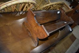 An Arts and Crafts style dark oak book trough
