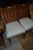 A pair of Edwardian mahogany and inlaid salon chairs
