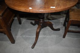 A 19th Century oak snap top pedestal table