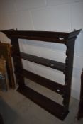 A traditional dark stained delft rack, wall mounted with open back, width approx. 96cm