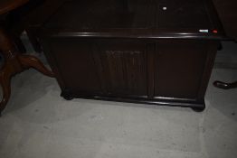 A Priory style dark stained bedding box